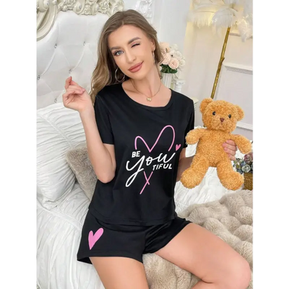 Black pajama set with heart design.