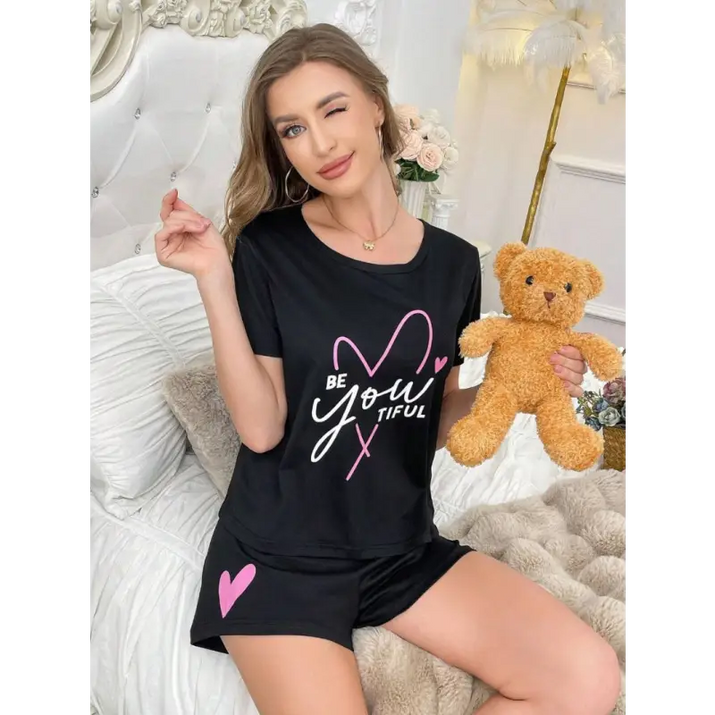 Black pajama set with heart design.