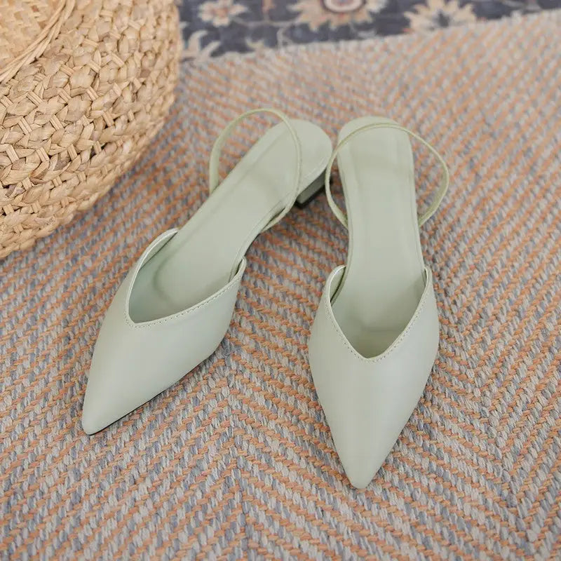 Pair of light green slingback heels.
