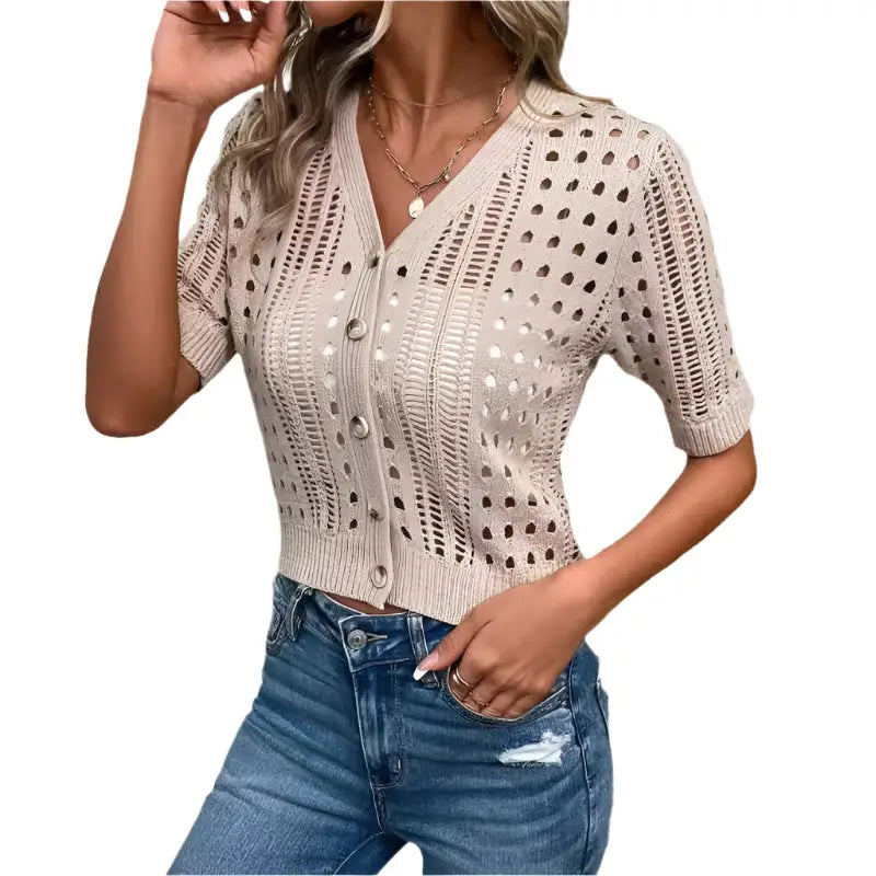 Beige, open-knit, button-down cardigan.