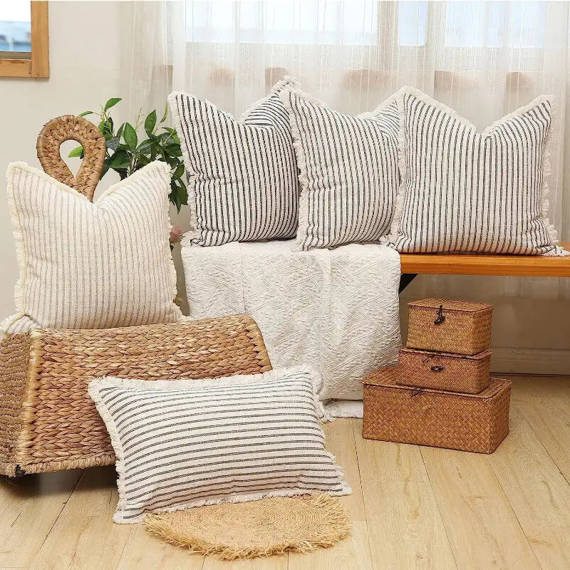 Yarn-dyed wool cushion with striped throw pillows and fringe for cozy decor