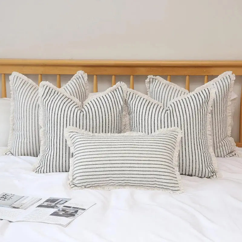 Yarn-dyed wool cushion with striped pattern and fringe for cozy home decor